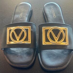 Valentino Black Leather Slides with Gold V Logo Plaque
